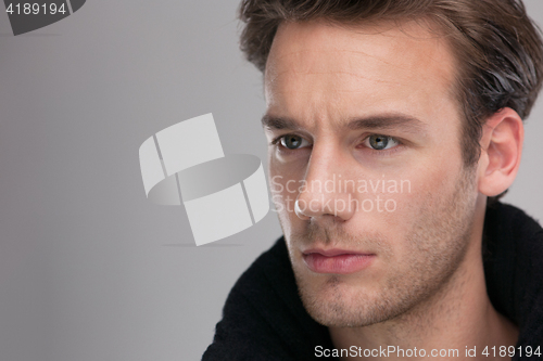 Image of portrait of a young guy over gray background