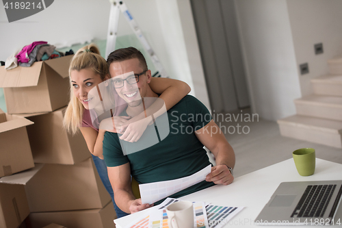 Image of Young couple moving in a new home