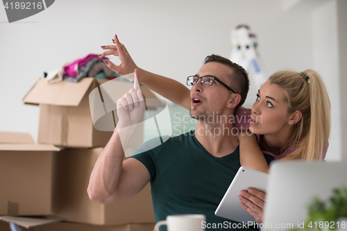 Image of Young couple moving in a new home