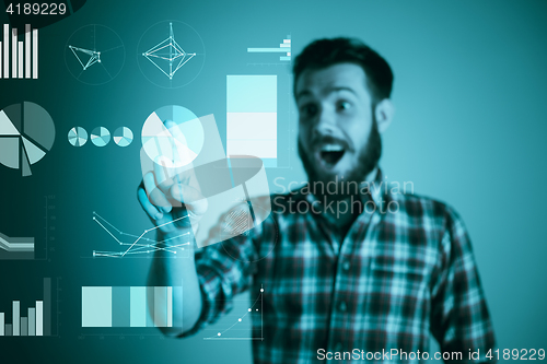 Image of Handsome young man with idea bulb on blue