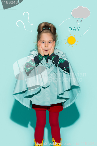 Image of Little girl posing in fashion style wearing autumn clothing.