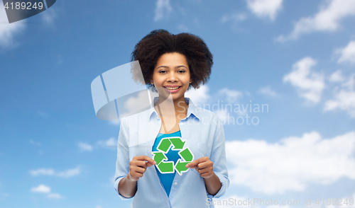 Image of happy afro american woman over blue sky