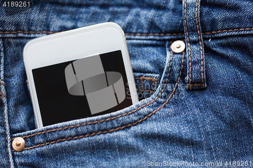 Image of smartphone in pocket of denim pants or jeans