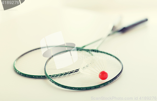 Image of close up of badminton rackets with shuttlecock