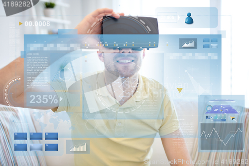 Image of young man in virtual reality headset or 3d glasses