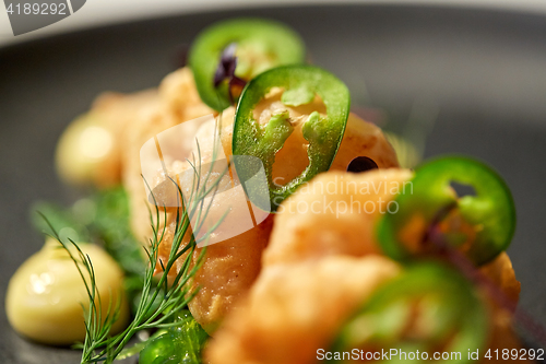 Image of close up of king prawns with jalapeno