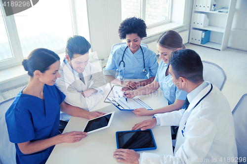 Image of group of happy doctors meeting at hospital office