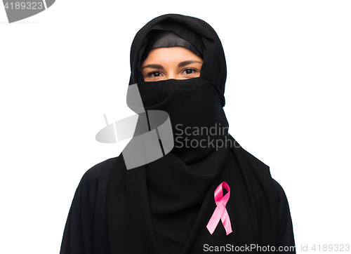 Image of muslim woman with breast cancer awareness ribbon
