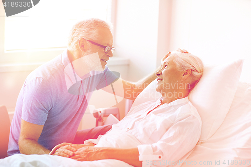 Image of senior couple meeting at hospital ward