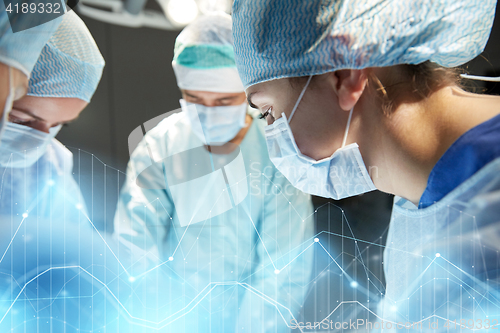 Image of group of surgeons in operating room at hospital