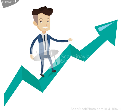 Image of Happy businessman standing on profit chart.