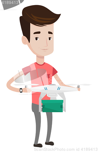Image of Man controlling delivery drone with post package.