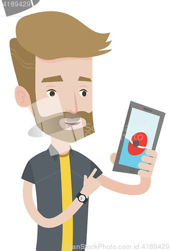 Image of Man playing action game on smartphone
