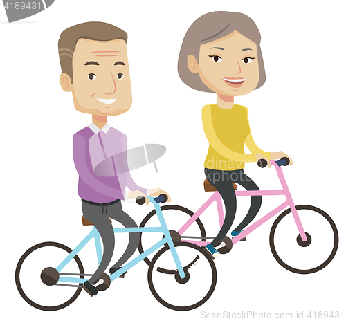 Image of Happy senior couple riding on bicycles.