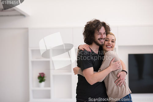 Image of couple hugging in their new home