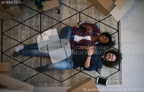 Image of Top view of attractive young multiethnic couple