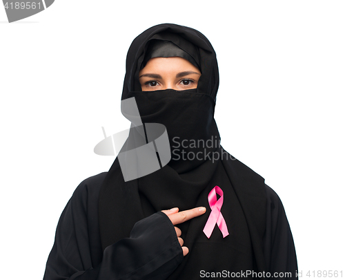 Image of muslim woman with breast cancer awareness ribbon