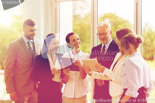 Image of business people with tablet pc computers at office