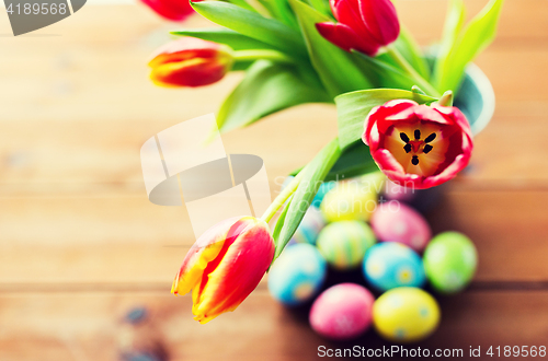 Image of close up of easter eggs and flowers in bucket