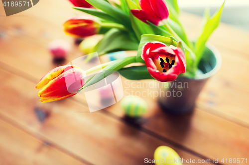 Image of close up of easter eggs and flowers in bucket