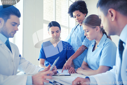 Image of group of doctors meeting at hospital office