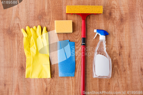 Image of swab with cleaning stuff on wooden background