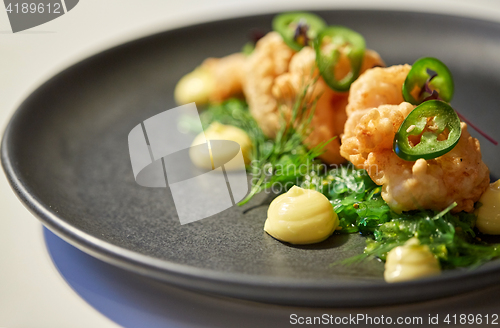 Image of close up of prawn salad with jalapeno and wakame