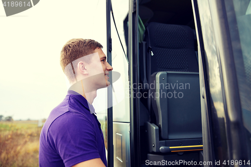 Image of group of happy male passenger boarding travel bus