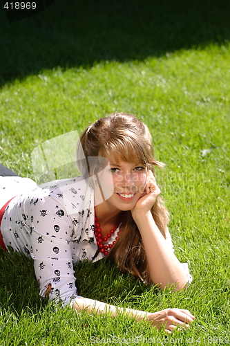 Image of Pretty Teen Girl Lying in Grass