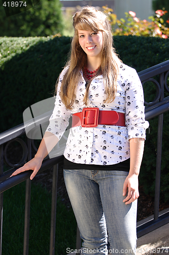 Image of Pretty Teen Girl Next To Railing