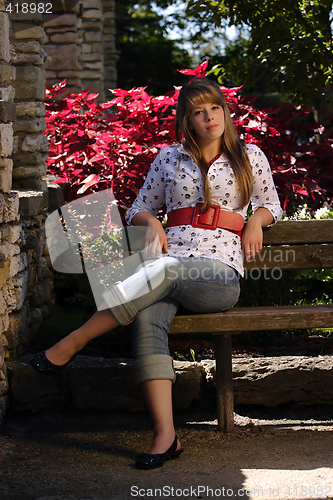 Image of Prety teenage Girl Sitting on Bench