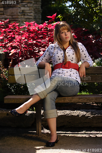 Image of Girl Sitting on a Park Bench