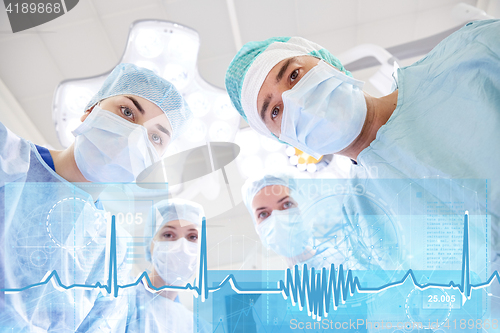 Image of group of surgeons in operating room at hospital