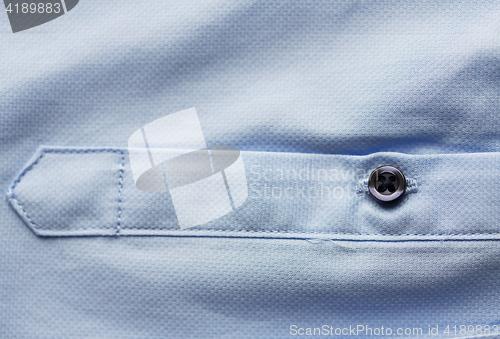 Image of close up of blue shirt sleeve