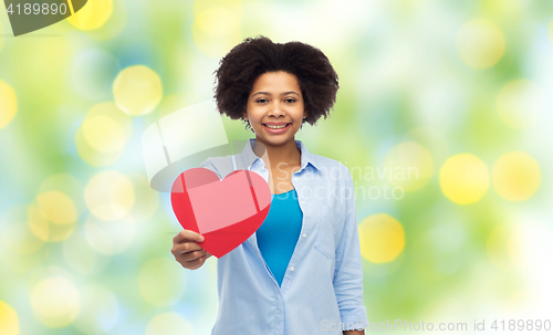 Image of happy african american woman with red heart shape