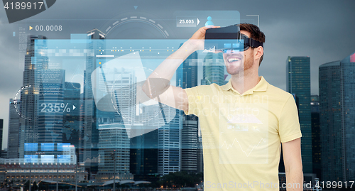 Image of happy man in virtual reality headset or 3d glasses