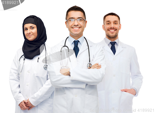 Image of happy doctors in white coats with stethoscopes