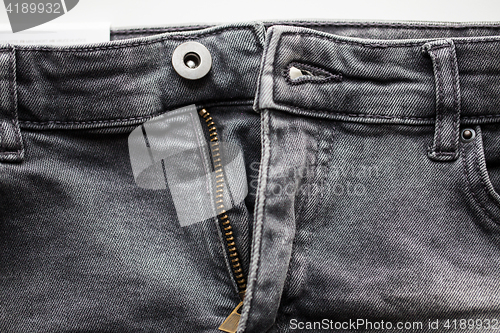 Image of close up of denim pants or jeans with zipper