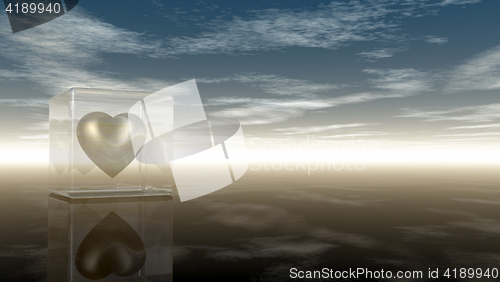 Image of heart symbol in glass cube under cloudy sky - 3d rendering