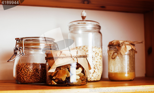 Image of real comfort wooden kitchen with breakfast ingredients close up 