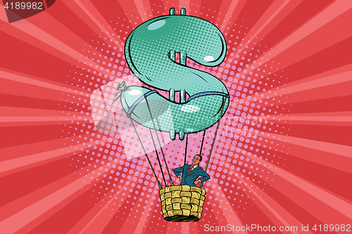 Image of businessman in a hot air balloon dollar