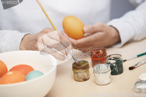 Image of Woman preparing Easter eggs