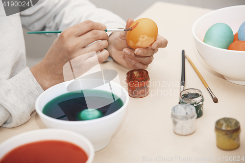 Image of Woman preparing Easter eggs