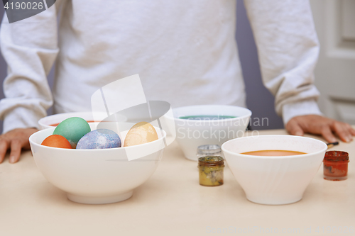 Image of Woman preparing Easter eggs