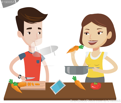 Image of Couple cooking healthy vegetable meal.