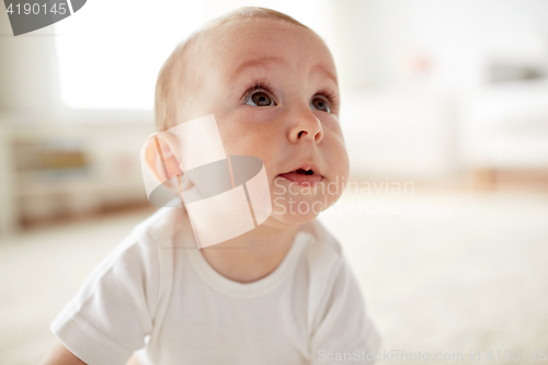 Image of close up of happy little baby boy or girl at home