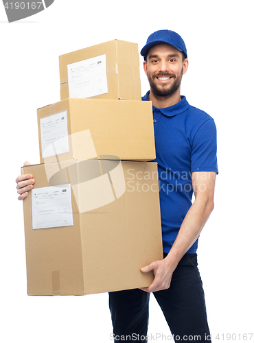 Image of happy delivery man with parcel boxes