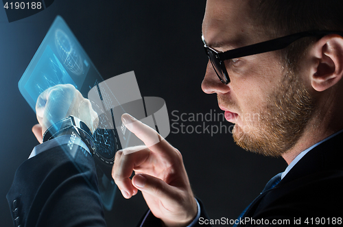 Image of close up of businessman with smart watch