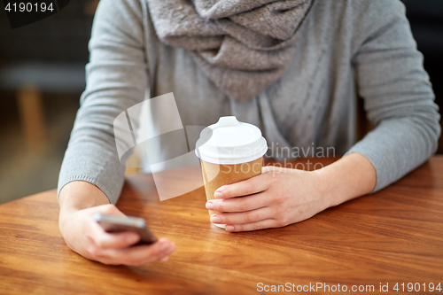 Image of close up of woman with smartphone and coffee