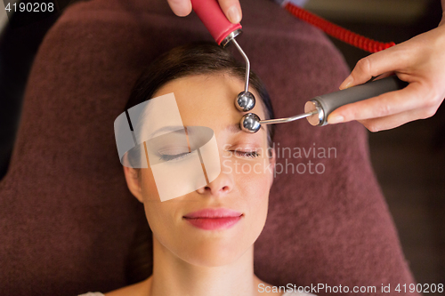 Image of woman having hydradermie facial treatment in spa